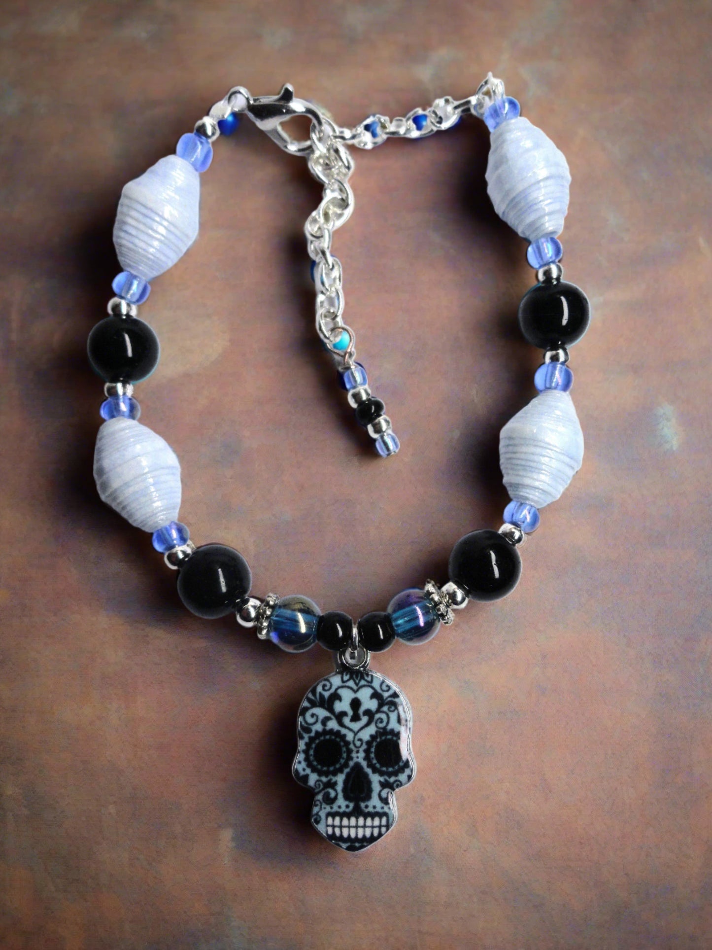 Adjustable Sugar Skull Bracelet With Pastel Blue Handmade Paper Beads and Glass Beads