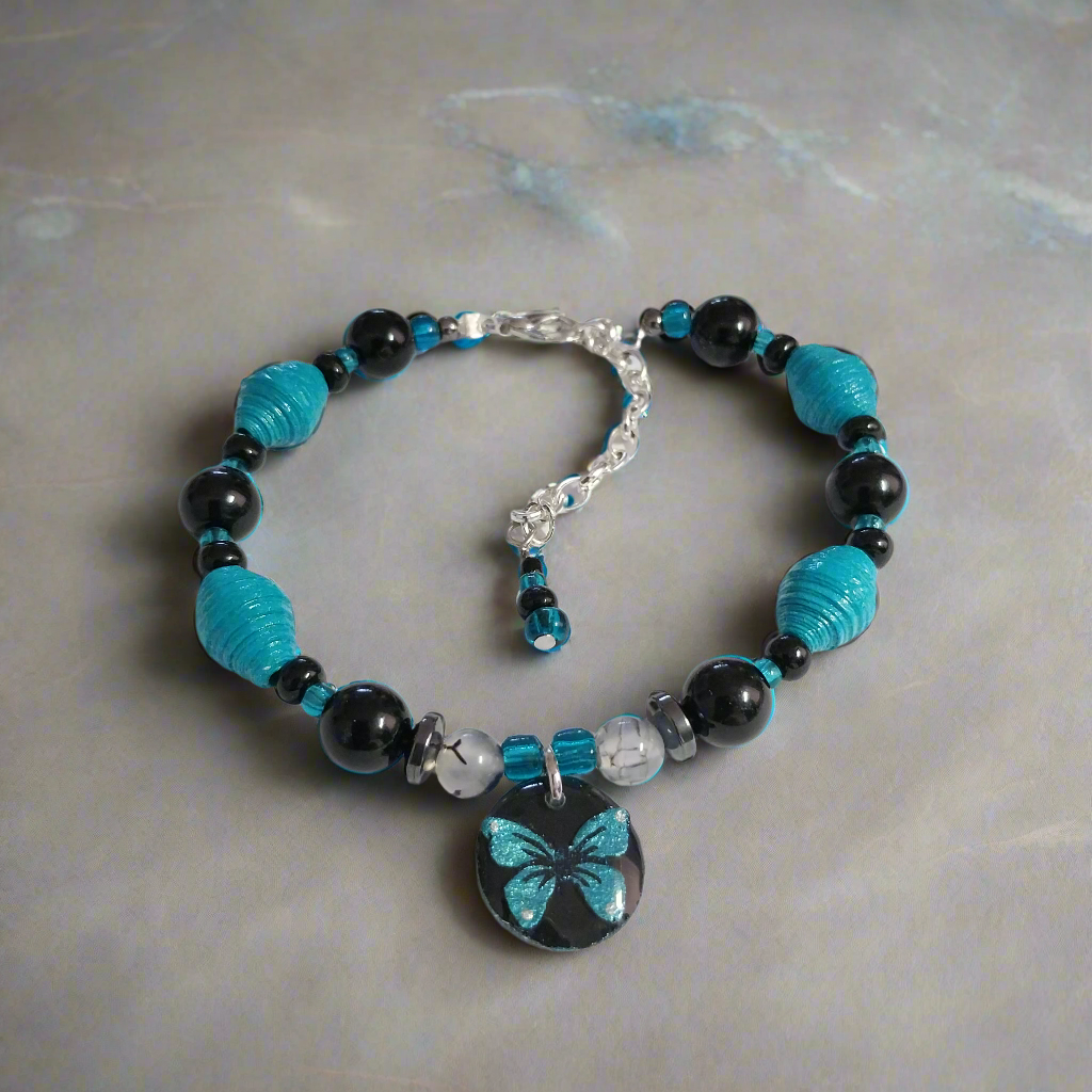 Adjustable Teal Butterfly Bracelet With Handmade Paper Beads and Glass Beads